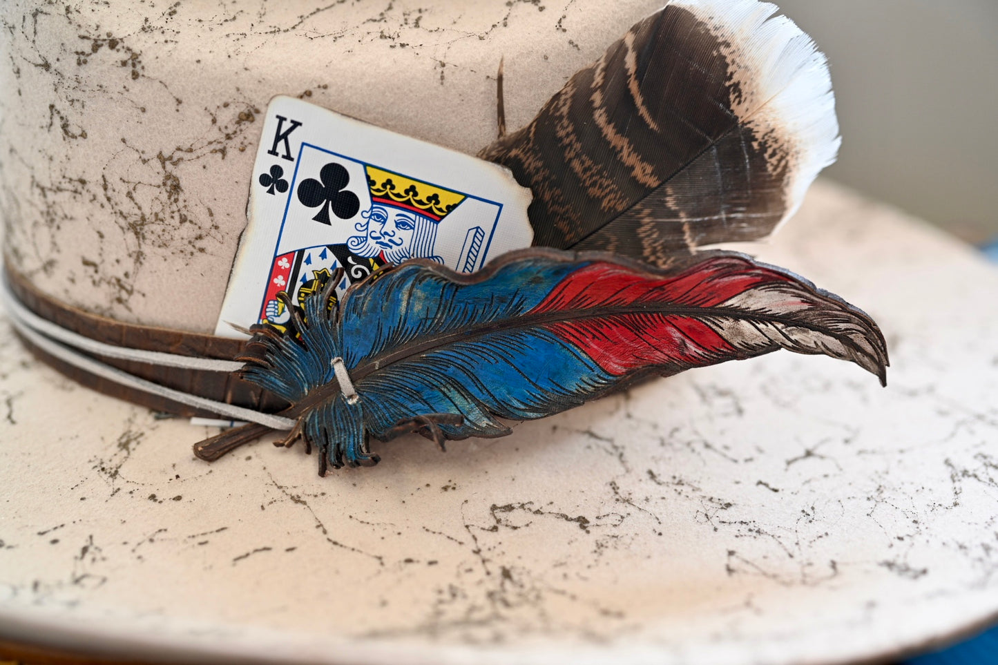 Cowboy hat with custom leather feather