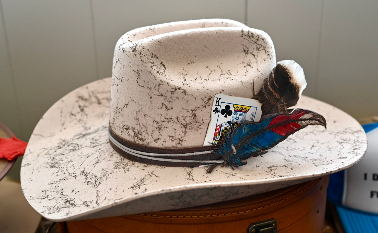 Cowboy hat with custom leather feather