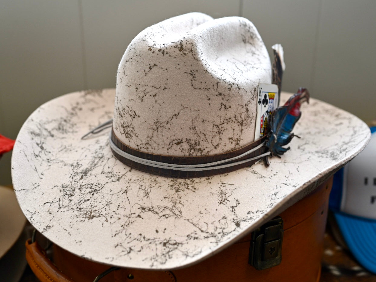 Cowboy hat with custom leather feather